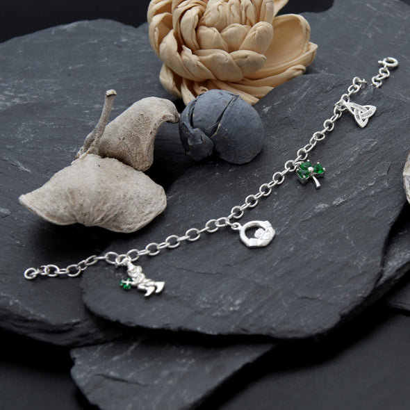 Alexander Castle Sterling Silver Irish Charm Bracelet with Leprechaun, Claddagh, Shamrock and Trinity Charms. Comes in a Jewellery Presentation Gift Box